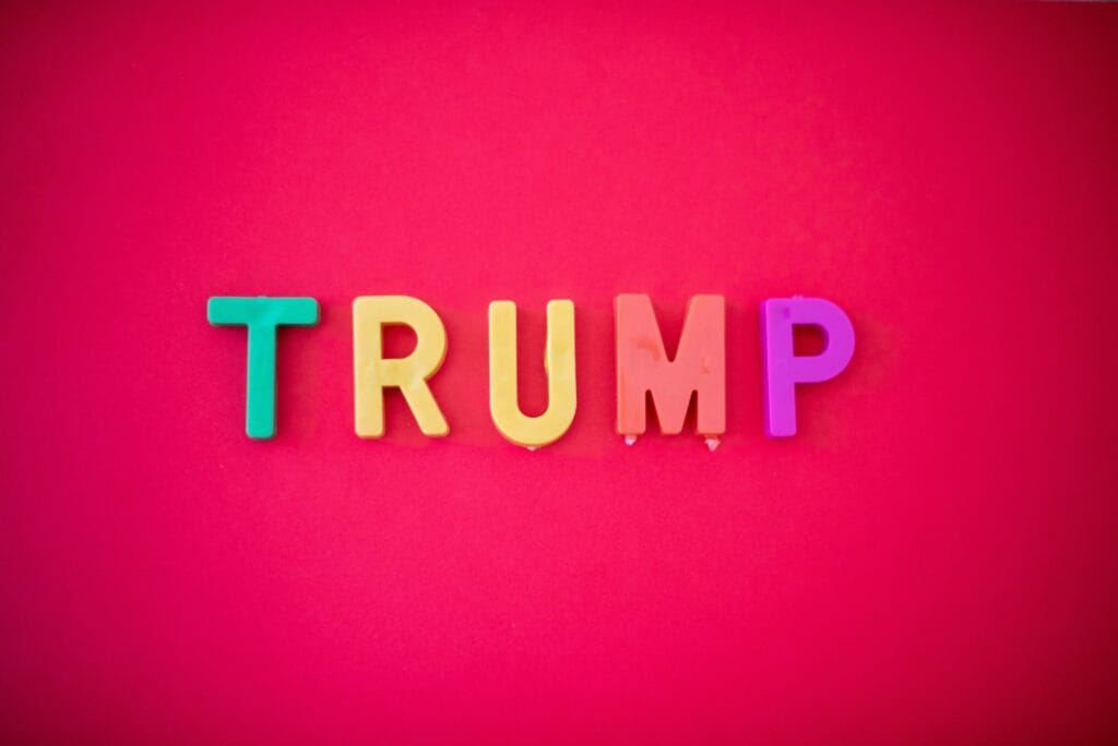 The word TRUMP isolated against red background shot from directly above